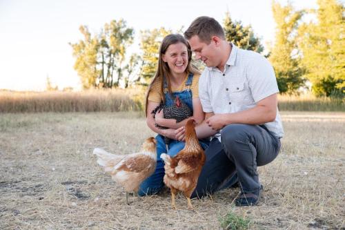 Jenae and Connor Dean with their chickens at their rental home in Salem Idaho.